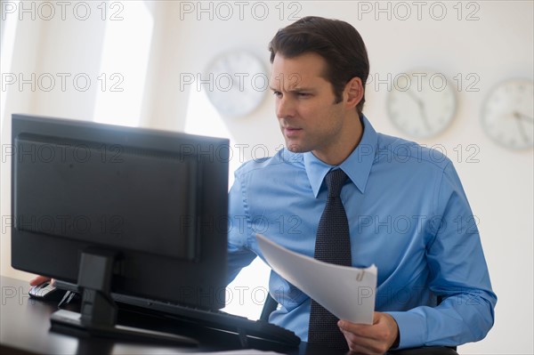 Businessman working on computer.