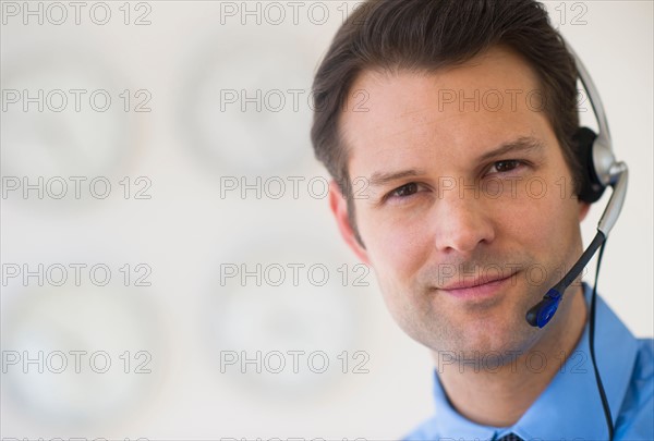 Portrait of male customer service representative.