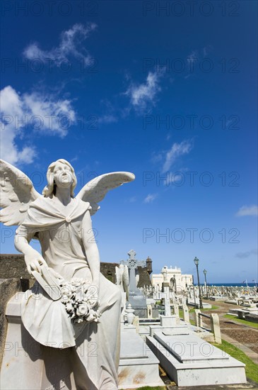 Puerto Rico, Old San Juan, Santa Maria Magdalena Cemetery with El Morro Fortress in background .