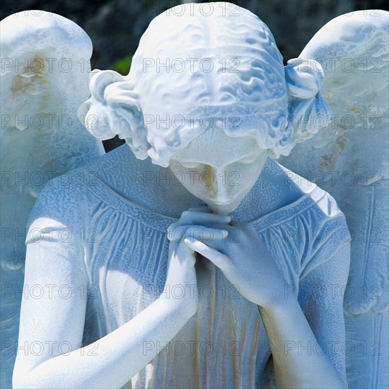 Puerto Rico, Old San Juan, Santa Maria Magdalena Cemetery, Close-up view of praying angel statue.