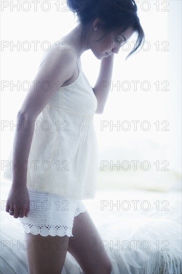 Young attractive woman wearing laced nightwear.