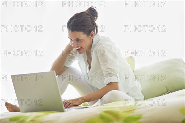 Young attractive woman using laptop.