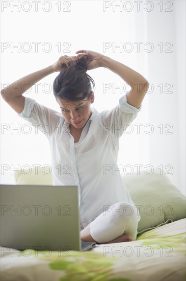 Young attractive woman using laptop.