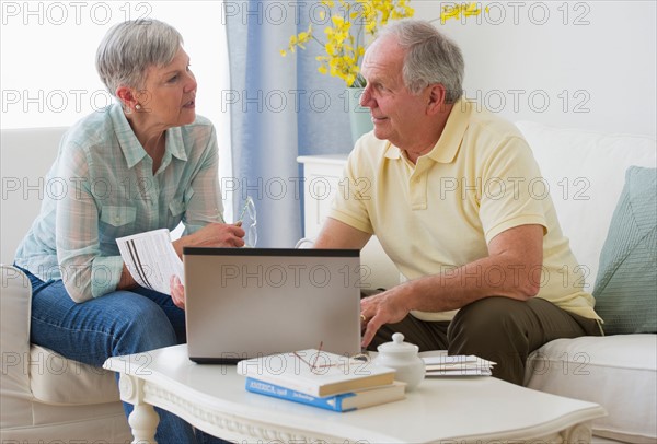 Senior couple with laptop.