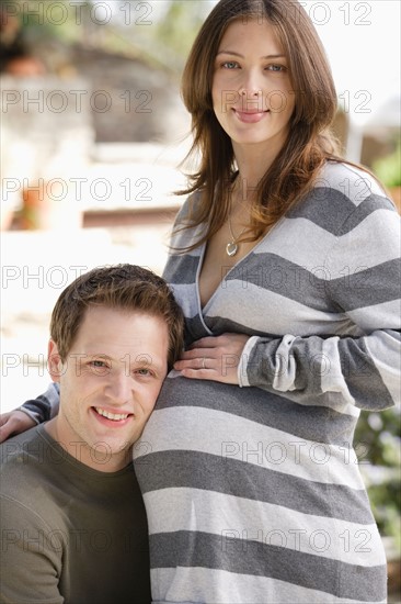 Portrait of expecting couple. Photo : Rob Lewine