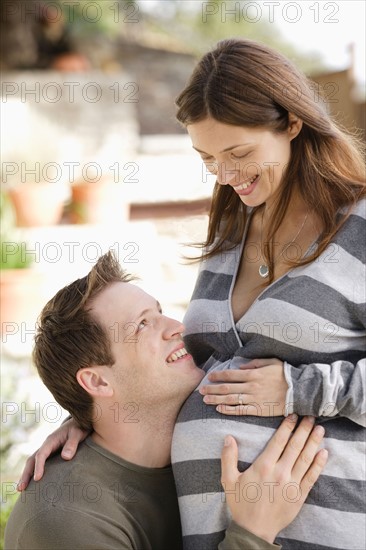 Portrait of expecting couple. Photo : Rob Lewine