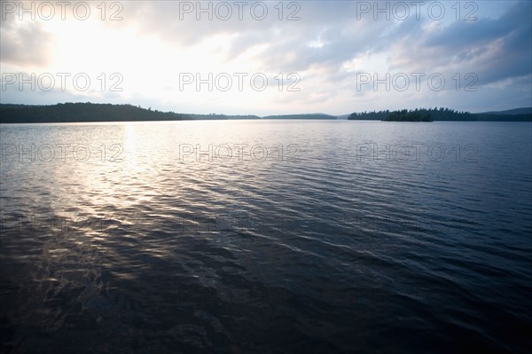 USA, New York State, View of Adirondack Mountains over Upper Saranac Lake. Photo : Chris Hackett