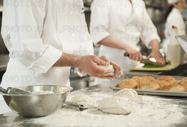 Chef doing pastry to make rolls.