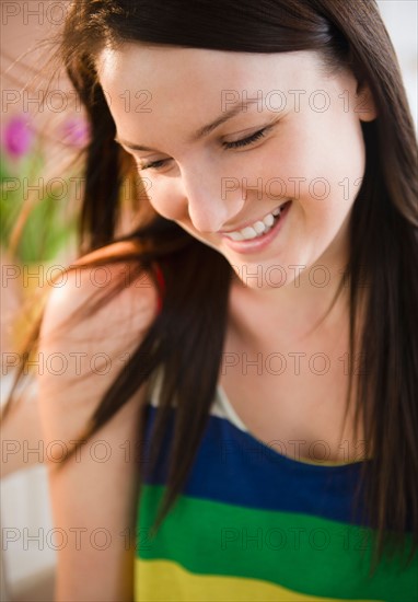 Portrait of smiling young woman. Photo : Jamie Grill Photography