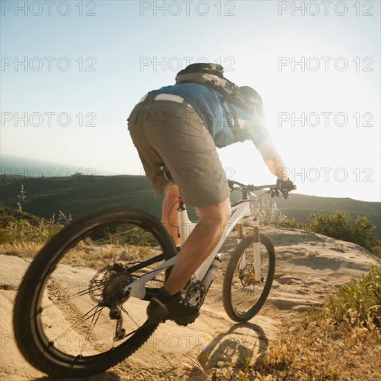 USA, California, Laguna Beach, Mountain biker riding downhill.