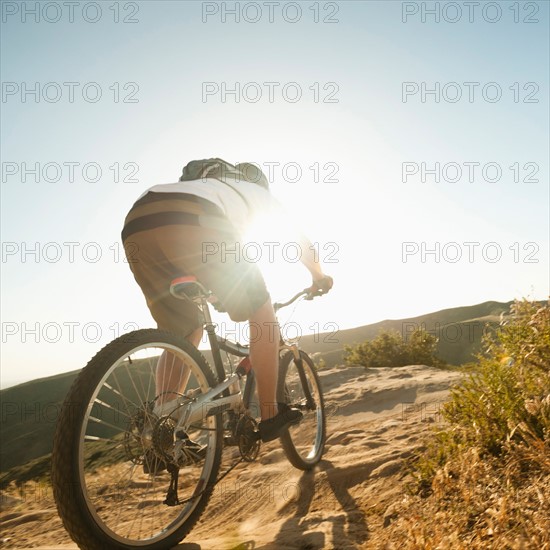 USA, California, Laguna Beach, Mountain biker riding downhill.