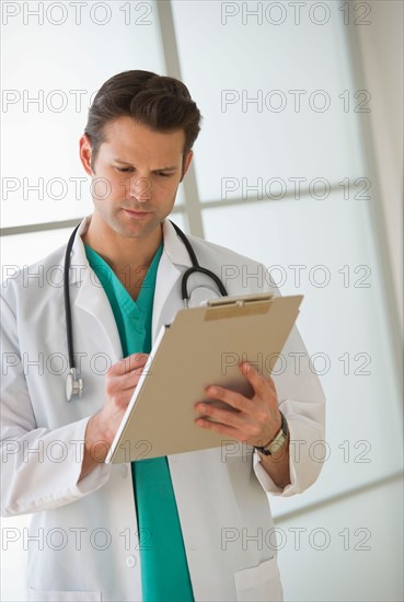 Doctor filling medical documents.