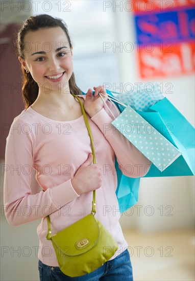 Teenage girl (14-15) shopping.