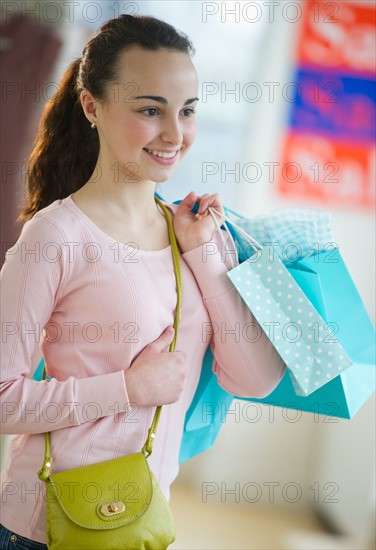 Teenage girl (14-15) shopping.