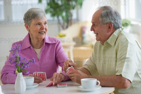 Senior couple playing cards.