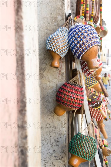 Brazil, Bahia, Salvador De Bahia, Rattles hanging against wall, close-up. Photo : Jamie Grill Photography