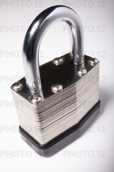 Close-up studio shot of silver padlock . Photo : Winslow Productions