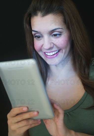 Young woman using digital tablet.