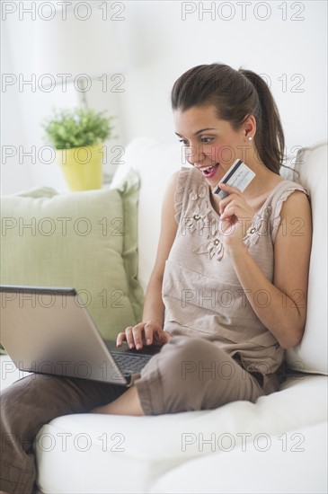 Young woman online shopping .