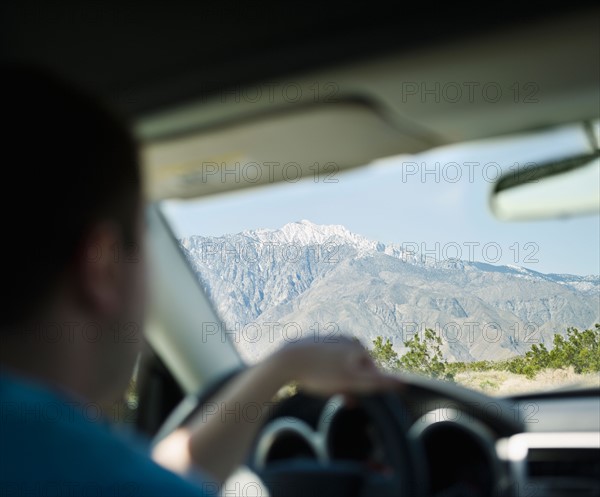 USA, California, Palm Springs, Coachella Valley, San Gorgonio Pass, Close up of man inside car. Photo : Jamie Grill Photography