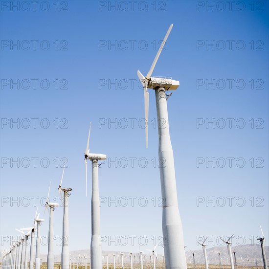 USA, California, Palm Springs, Coachella Valley, San Gorgonio Pass, Wind turbines against blue sky. Photo : Jamie Grill Photography