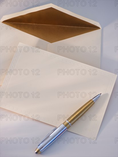 Blank paper, envelope and pen. Photo : Daniel Grill