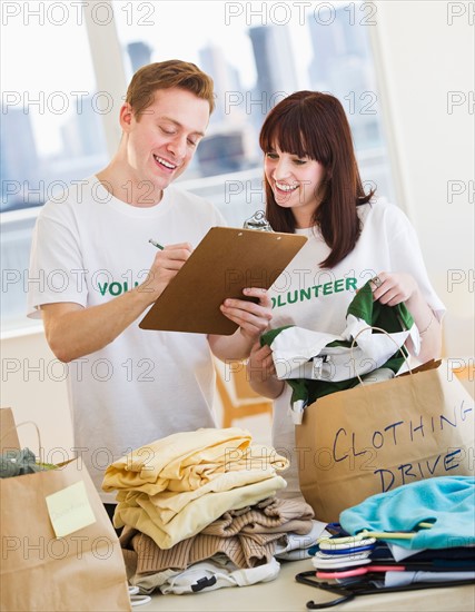 Volunteers organizing clothing drive. Photo : Daniel Grill