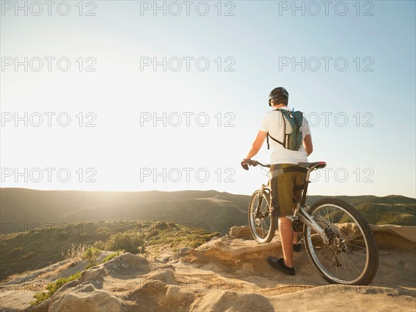 USA, California, Laguna Beach, Mountain biker on top of hill.