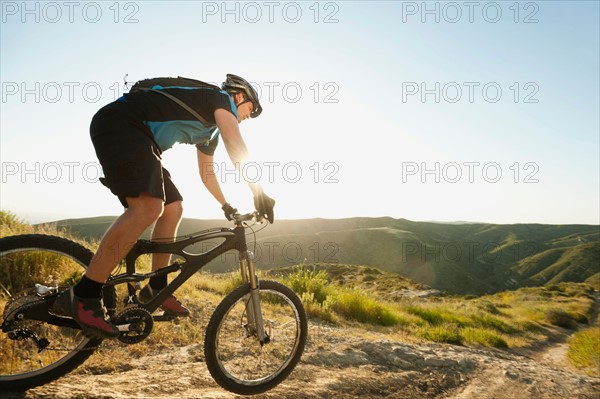 USA, California, Laguna Beach, Mountain biker riding downhill.