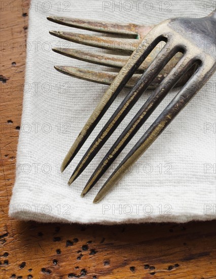 Two forks on napkin.