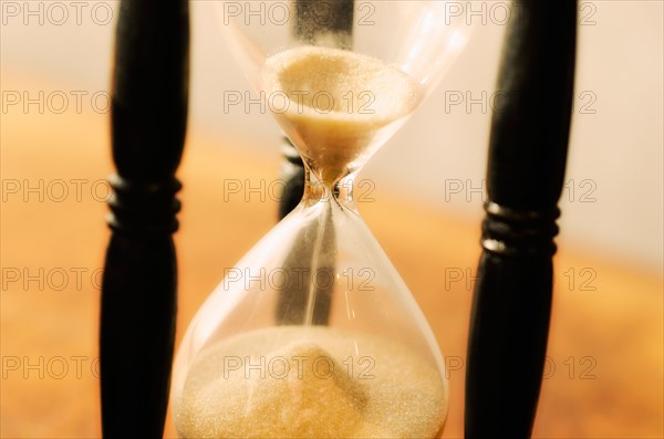 Hourglass with pouring sand.