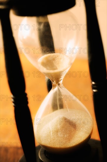Hourglass with pouring sand.