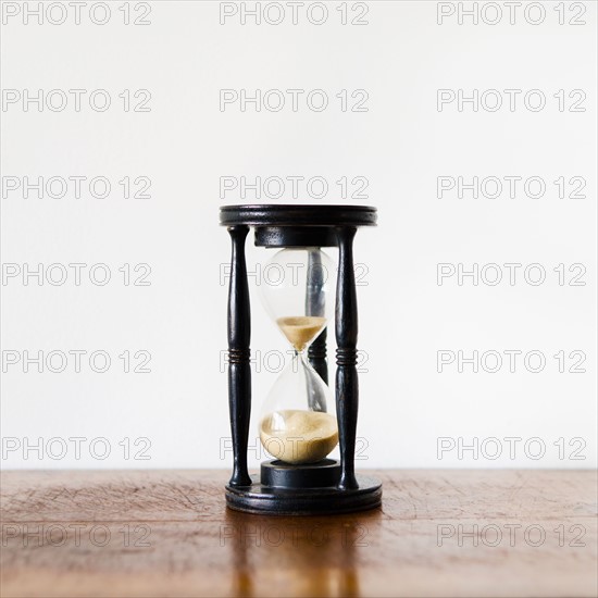 Hourglass with pouring sand.