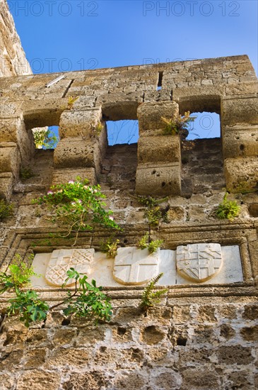 Greece, Rhodes, Medieval fortified wall with stone shields.