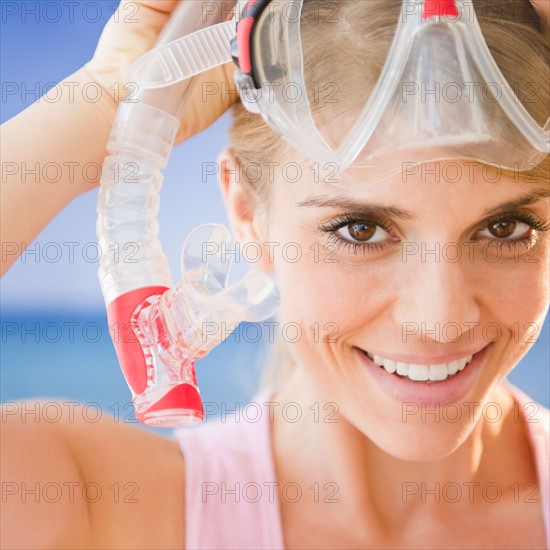 Portrait of smiling woman wearing snorkel mask. Photo : Jamie Grill