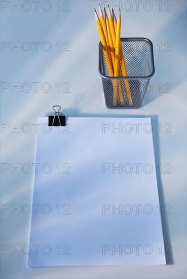 Paper and pencils in cup, studio shot. Photo: Daniel Grill