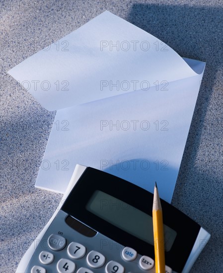 Calculator and blank paper. Photo: Daniel Grill