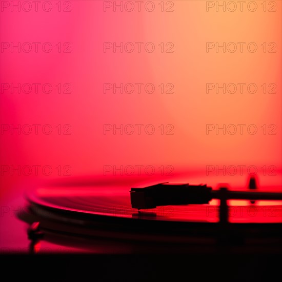 Close up of turntable on colored background. Photo: Daniel Grill