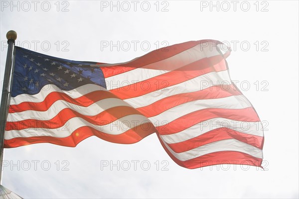 American flag against sky. Photo: fotog