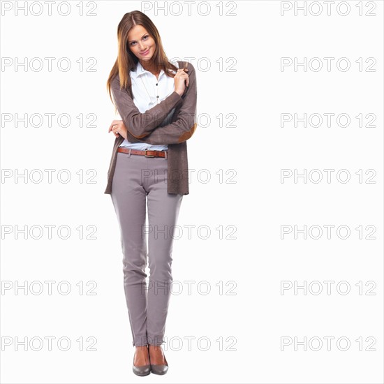 Studio shot of pretty business woman smiling. Photo : momentimages