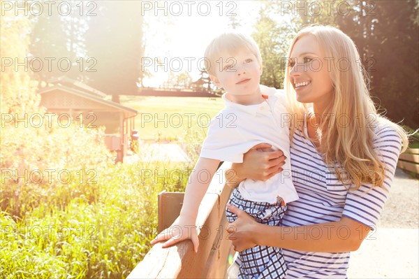 Young woman embracing son (2-3) in park. Photo : Take A Pix Media