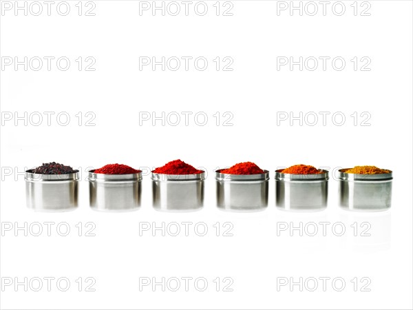 Studio shot of row of jars with spices. Photo : David Arky