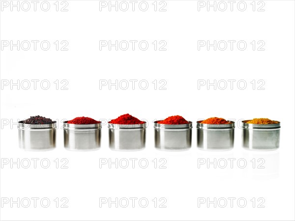 Studio shot of row of jars with spices. Photo: David Arky