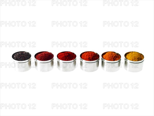 Studio shot of row of jars with spices. Photo : David Arky