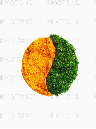 Studio shot of Carrot Powder making Yin and Yang sign on white background. Photo : David Arky