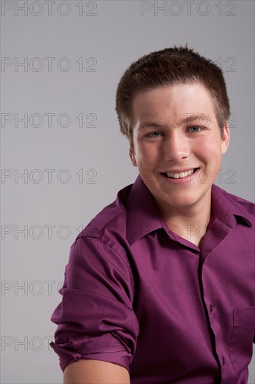 Portrait of smiling teenager, studio shot. Photo: Rob Lewine