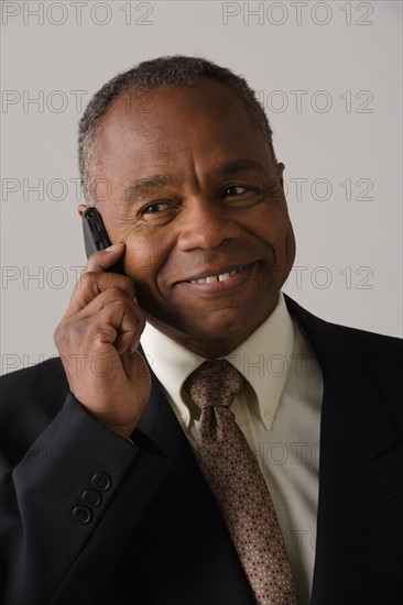 Portrait of mature businessman, studio shot. Photo : Rob Lewine