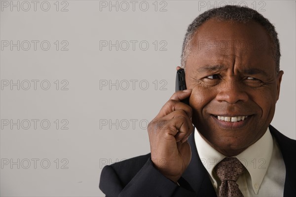 Portrait of mature businessman, studio shot. Photo : Rob Lewine