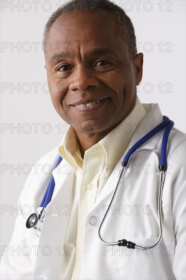 Portrait of doctor, studio shot. Photo : Rob Lewine