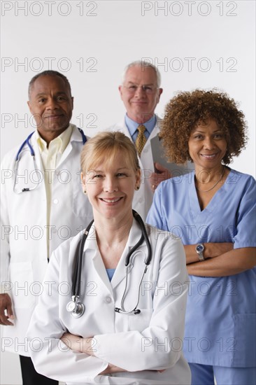 Portrait of four medical professionals, studio shot. Photo: Rob Lewine